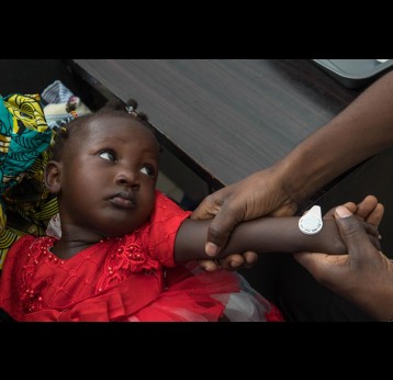 Girl getting a vaccine patch. Credit: Micron Biomedical