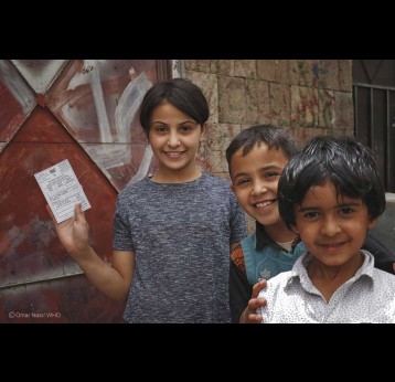 Children in Sana’a city holding immunisation cards. Credit: Omar Nasr/ WHO Yemen