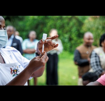 A health worker preparing a syringe with vaccine. Credit: Gavi/2022/Jjjumba Martin