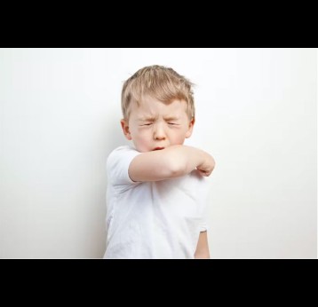 A small boy coughing. Credit: castiglioni veronica/Shutterstock