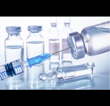 A syringe and vaccine vials. Credit: Mentor57/Shutterstock