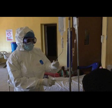 A doctor on a Lassa fever ward. Credit: WHO