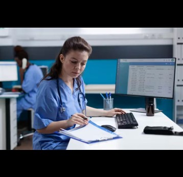 Medical worker in front of a computer. Credit: Shutterstock