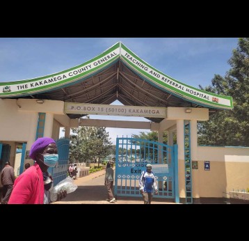 Clients walk past Kakamega County General Teaching and Referral Hospital (KCGTRH) on March15,2024. Credit: Angeline Anyango.