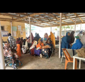 Carers with their children at Unguwa Uku health centre for an immunisation session. Credit: Afeez Bolaji