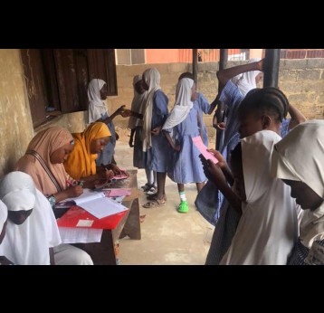 Pupils waiting to take HPV vaccine. Credit, Afeez Bolaji