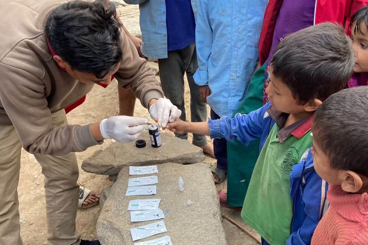 Health workers conducting Kala-Azar tests for children in Kalikot District. Credit: Katak Mahat