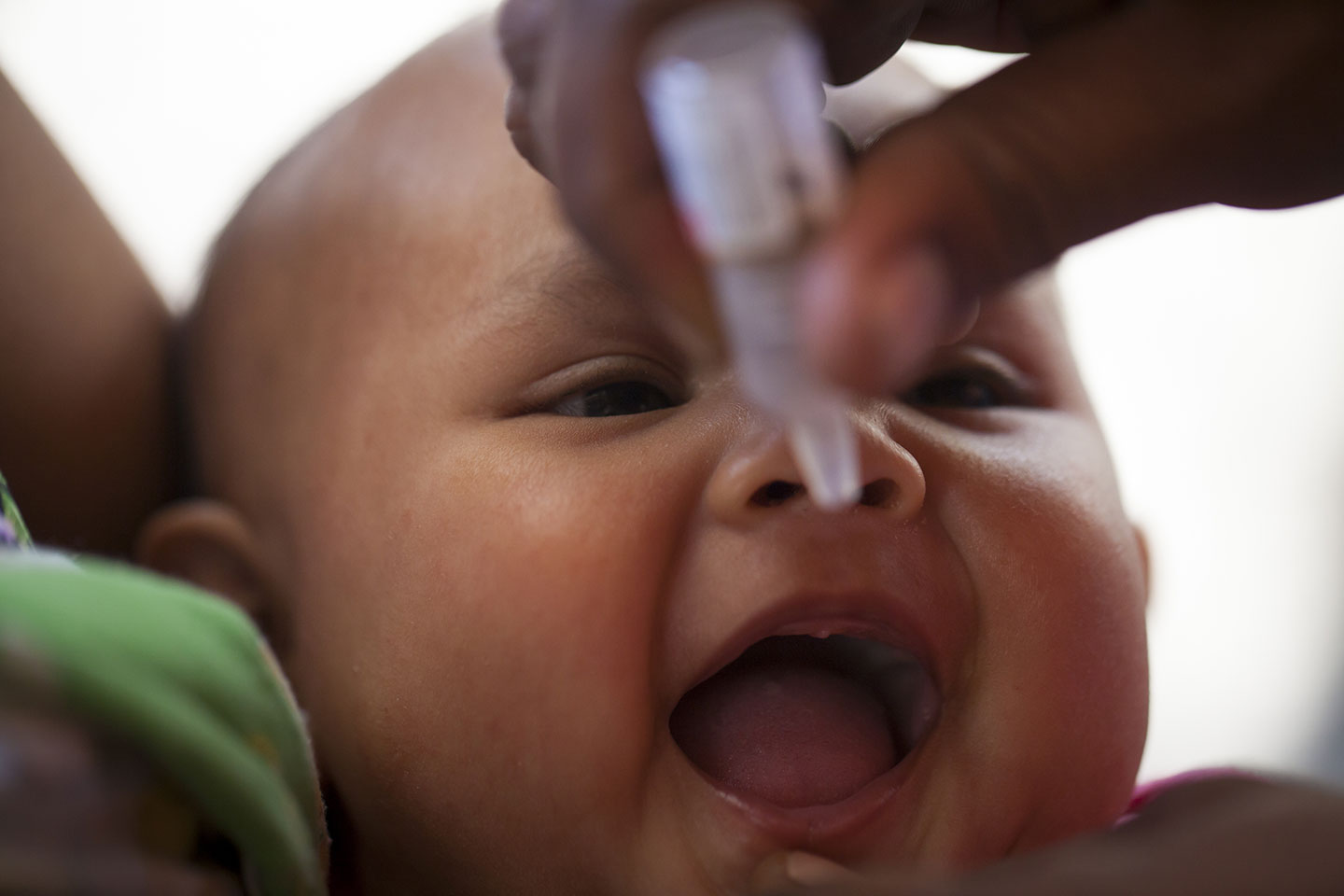 A baby receives the polio vaccine in Baucau Municipality. © UNICEF Timor-Leste/Soares.