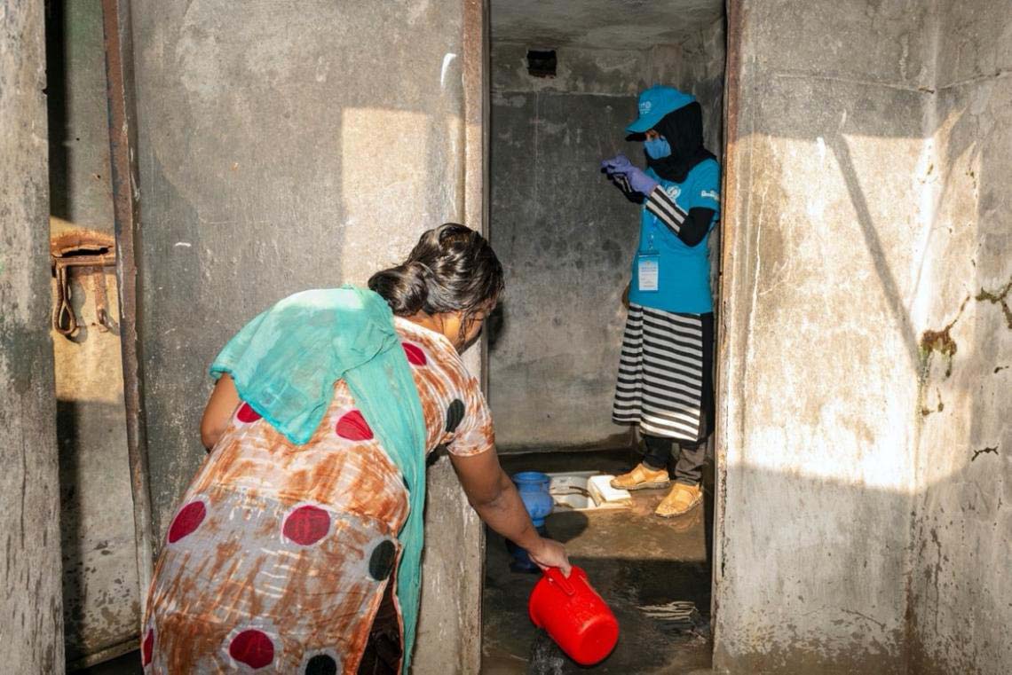 @ UNICEF Bangladesh/2020/Satu UNICEF volunteer Humayra Rezyona, 23, conducts a physical inspection on household toilets in Dhaka.