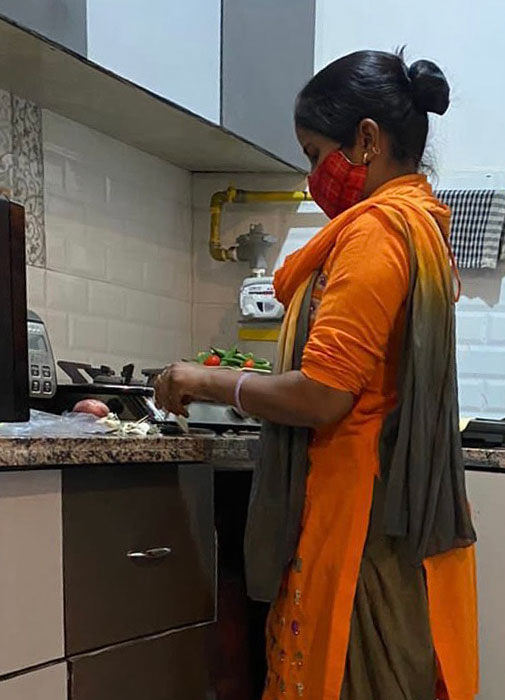 Cook Pooja Rani, who returned to work after getting vaccinated for COVID.