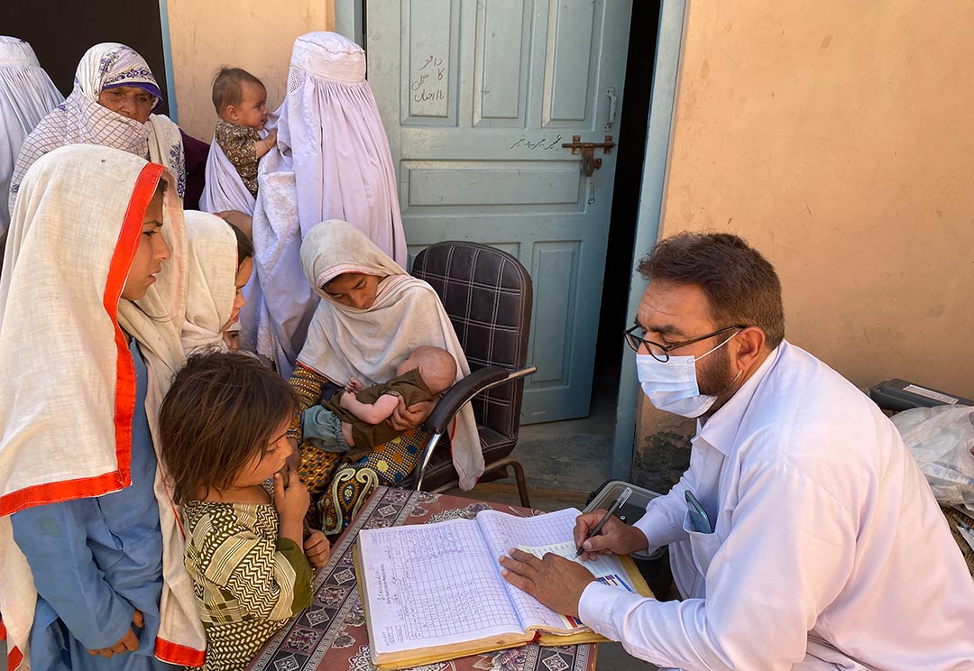 Unless the female CRPs go door-to-door to inform mothers that the vaccinator is in town conducting a session, mothers in purdah and their children are at risk of missing out. Credit: Huma Khawar