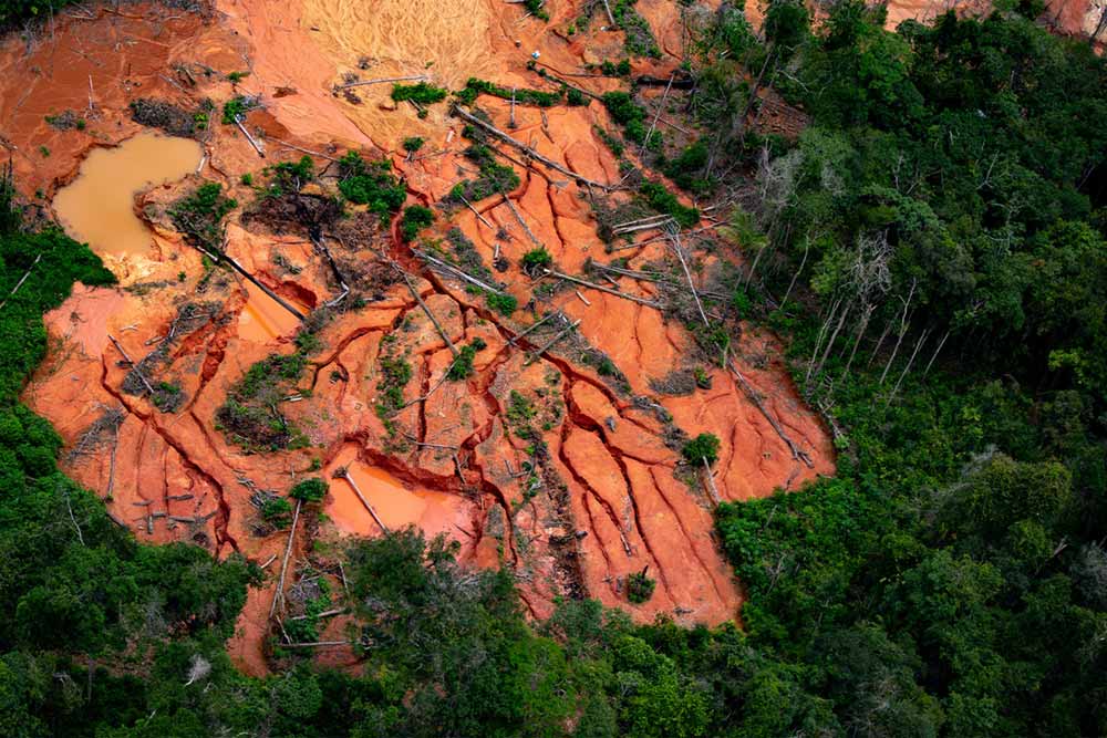 Illegal gold miners have wreaked havoc within the Yanomami Indigenous Territory for decades, with a spike in invasions and destruction during the Jair Bolsonaro administration from 2019 and 2022, fueled largely by the then-president’s pro-mining stance. Image © Christian Braga/Greenpeace.