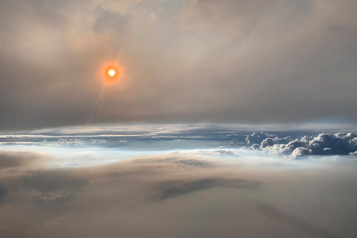 A large pyrocumulonimbus over Washington State, on August 8, 2019, taken at an altitude of roughly 30,000 feet (9000 meters). Pyrocumulonimbus events — also known as firestorms — are created when the intense heat from wildfires sends hot air high into the atmosphere. When the air cools and condenses, it forms a thundercloud. Lightning and intense winds from ‘pryoCbs’, can spark new fires which quickly spread. Image by David Peterson (US Naval Research Laboratory) via NASA.