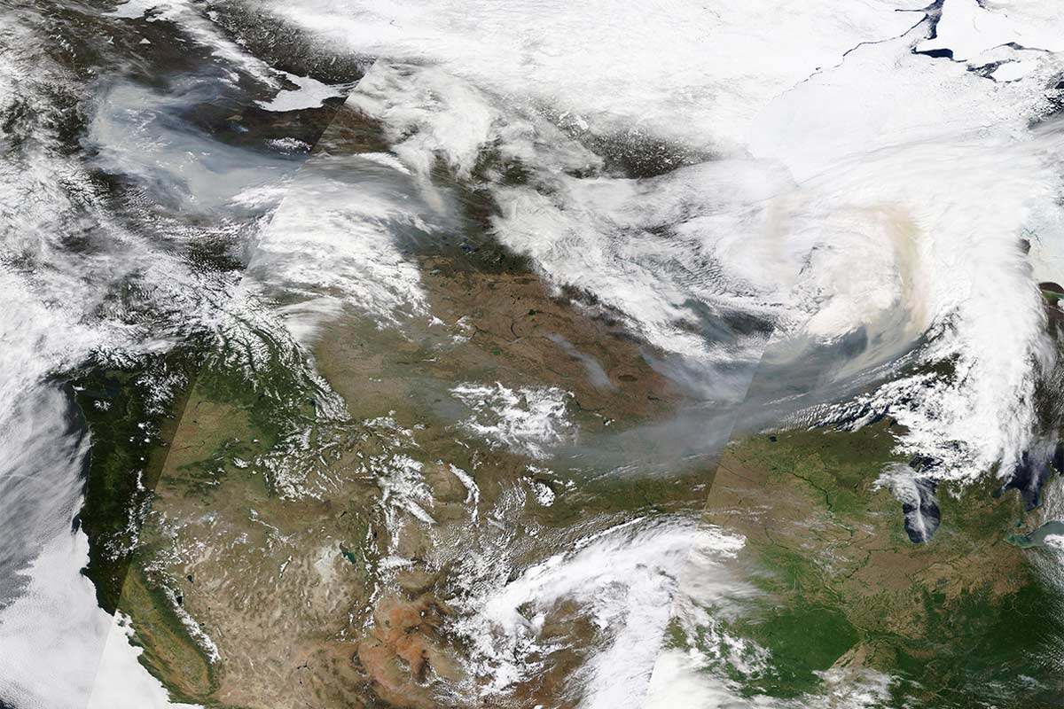 Satellite image of smoke from the Canadian wildfires on May 14, 2024. The 2024 Canadian fire season started early with 337,000 hectares burned by mid-May, primarily in the western province of British Columbia. Smoke from the Canadian wildfires drifted into the US, causing air quality alerts in four US states. Image by MODIS Land Rapid Response Team, NASA GSFC via Wikimedia Commons.