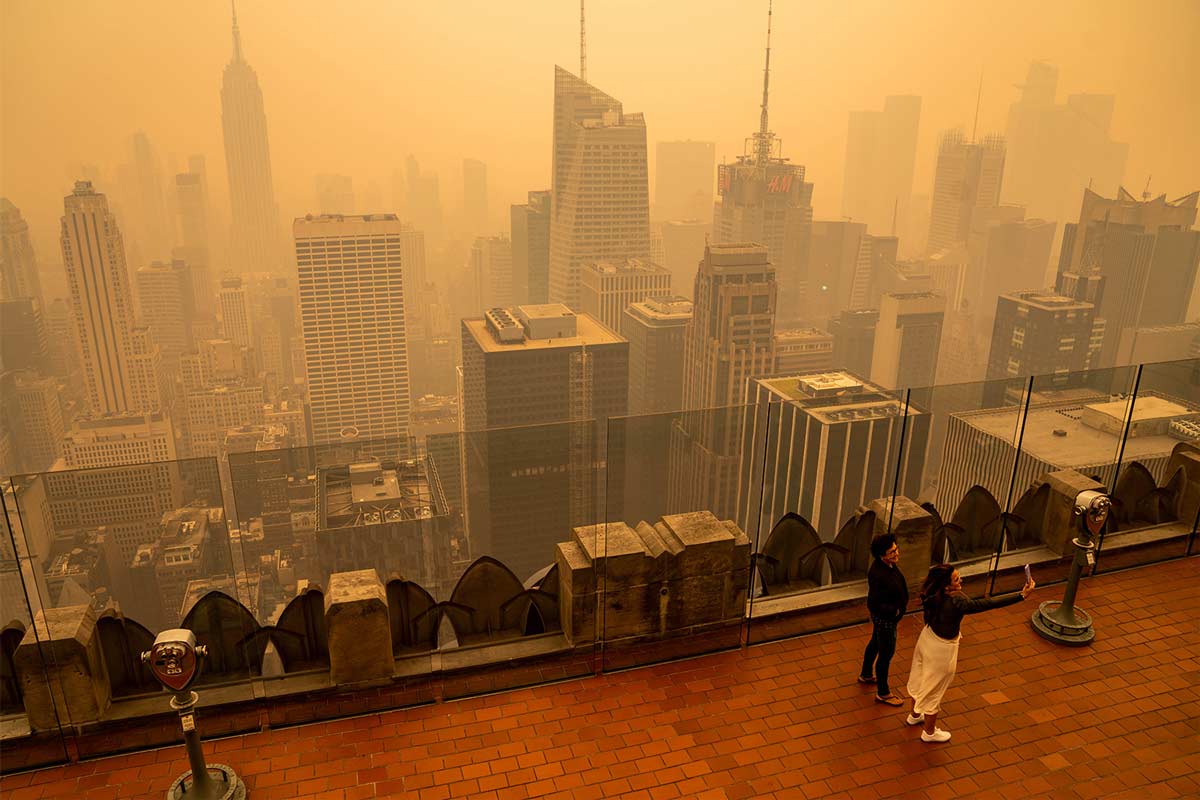 Smoke from the Canadian wildfires turns New York’s skies orange on June 7, 2023. Wildfire smoke is reversing or stalling progress on air quality in many US cities, according to a 2022 Nature study. Image by Anthony Quintano via Wikimedia Commons (CC BY 2.0).
