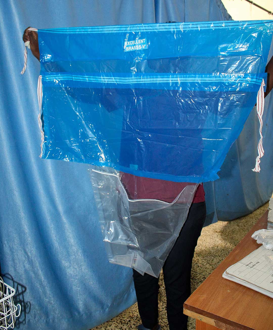 A health worker displays a calibrated blood collection drape. Credit: Muthoki Kithanze