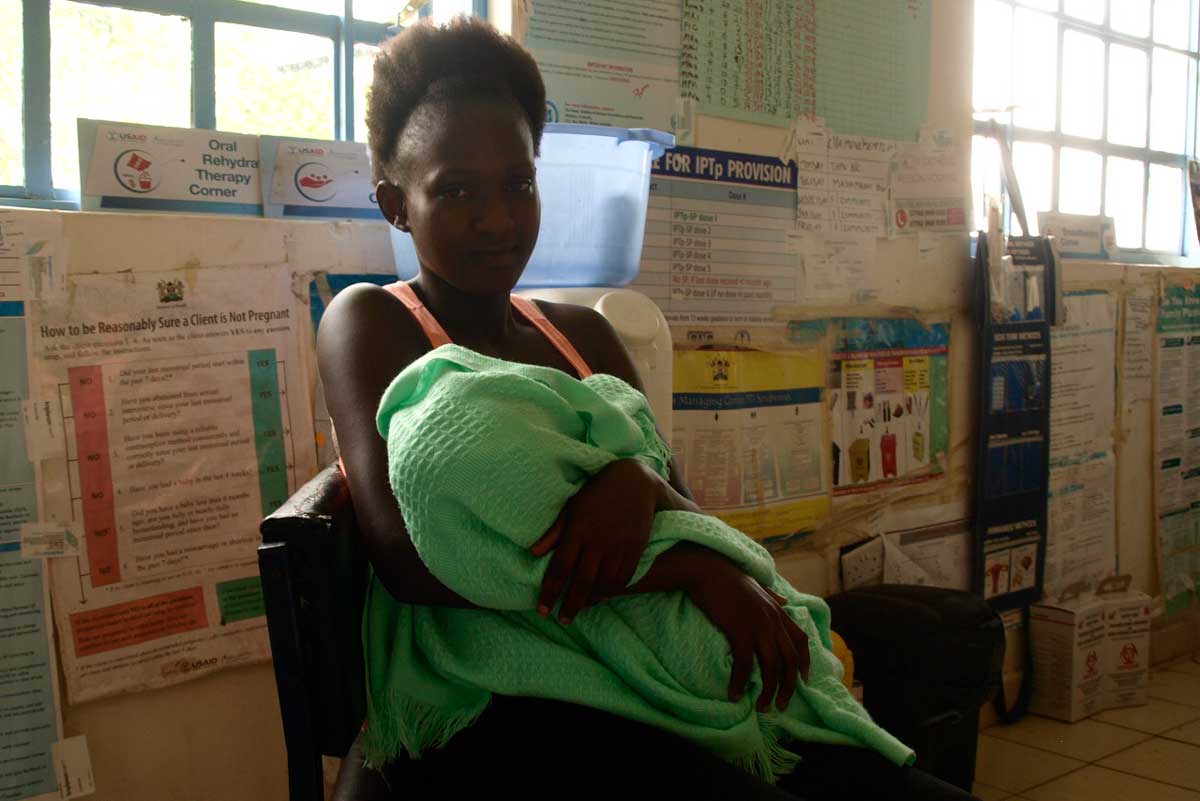 Josephine Opiny, with her baby Matthews, at Tamu Health Centre. Credit: Joseph Maina