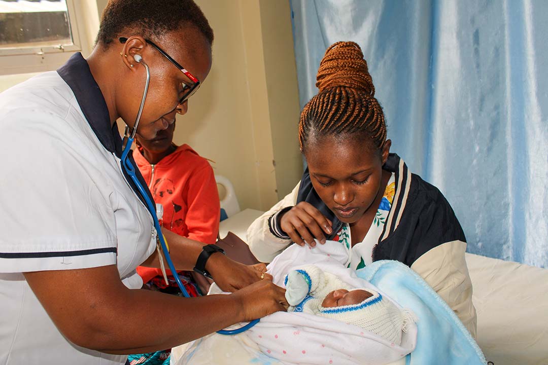 Lilian Mumbua and Gladys Musenya during a clinic visit at Makueni Referral Hospital. Credit: Muthoki Kithanze