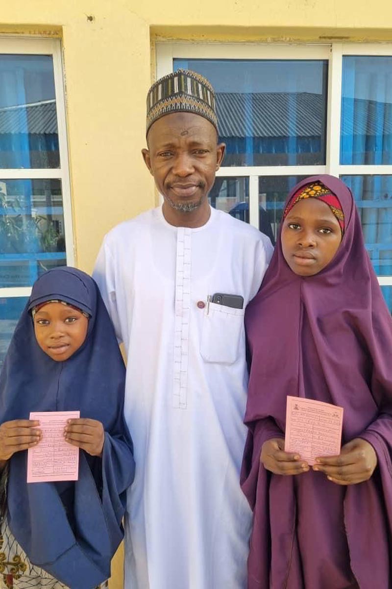 Maina Modu and his daughters, Fatima and Aisha, after getting a jab of the  HPV vaccine. Credit: Maina Modu