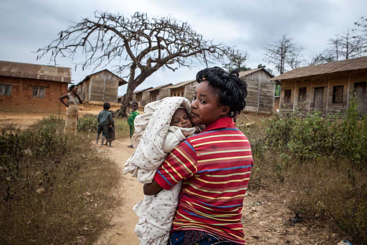A mother holds her baby in a DRC village, 2013. New technologies have brought underserved villages into closer contact with the health system. Credit: Gavi/2013/Evelyn Hockstein