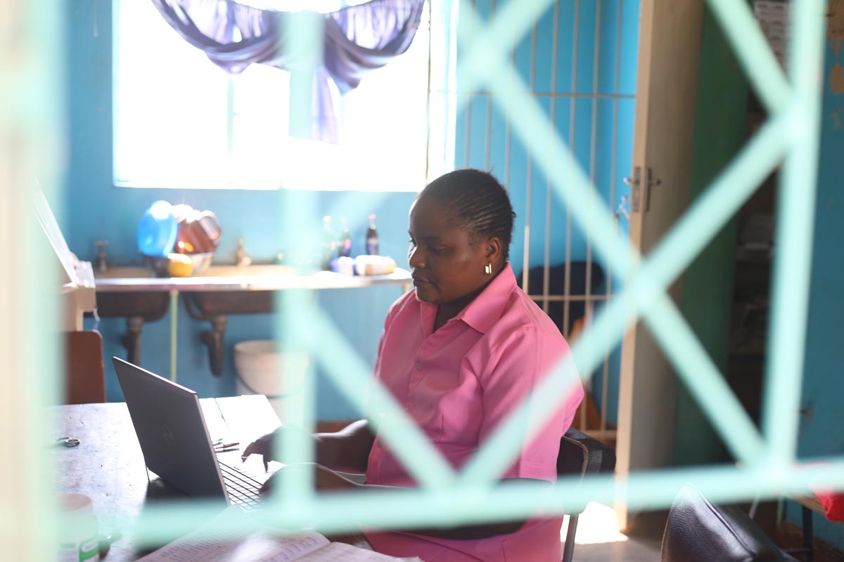 Joyce Mayanga, a nurse aide, capturing data at Hakwata Clinic, Chipinge. Credit: Farai Shawn Matiashe/2024/Gavi.