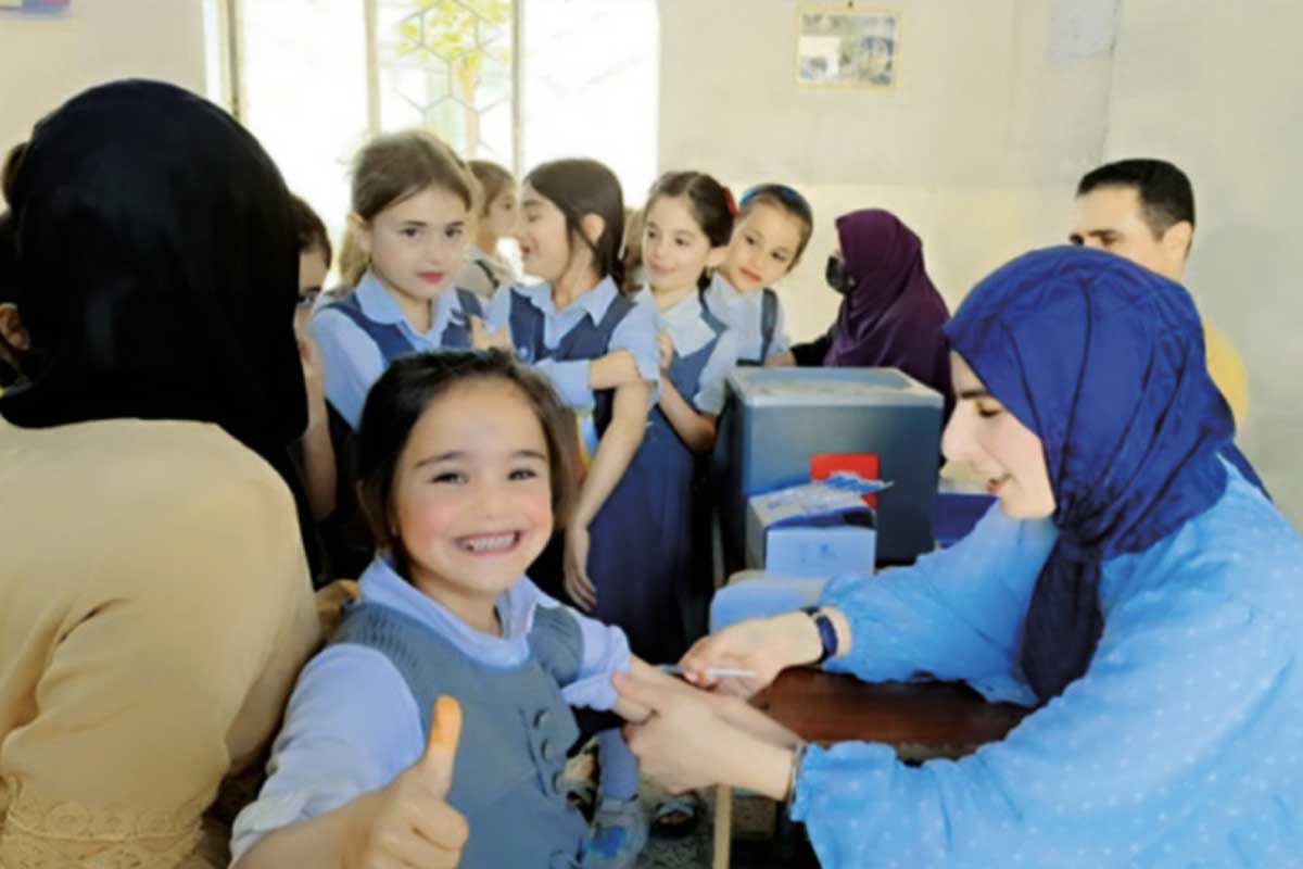 Najeeb Al Saadi Kalakchi Town School, Iraq A smiling student received MMR vaccine in her school during a national supplementary immunisation activity (SIA) in April 2024.