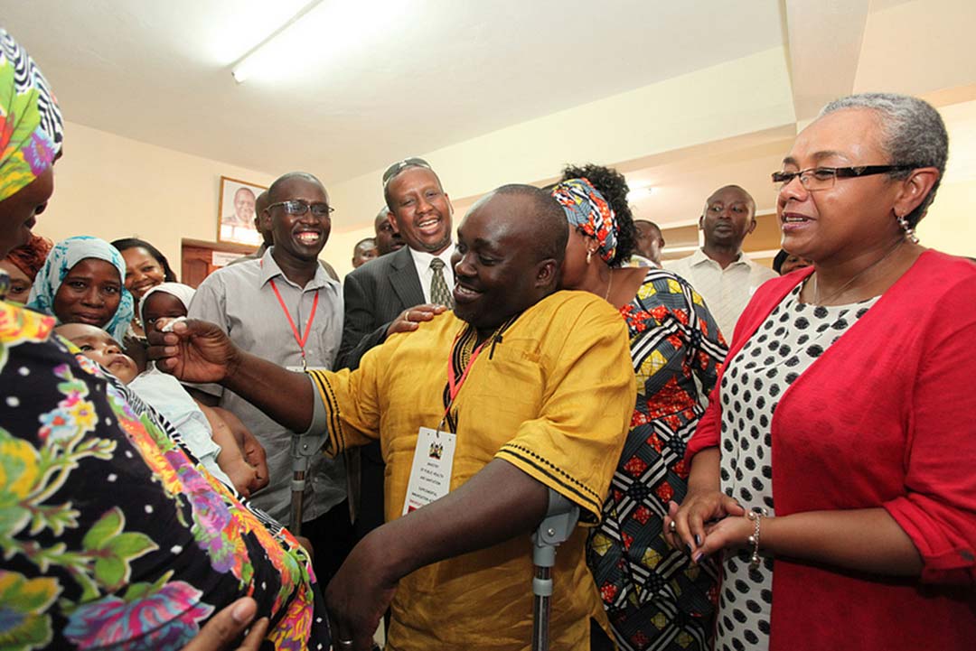 Senator Harold Kipchumba, a polio survivor, gives the polio vaccine to a child. Credit: UNICEF ESARO 2013