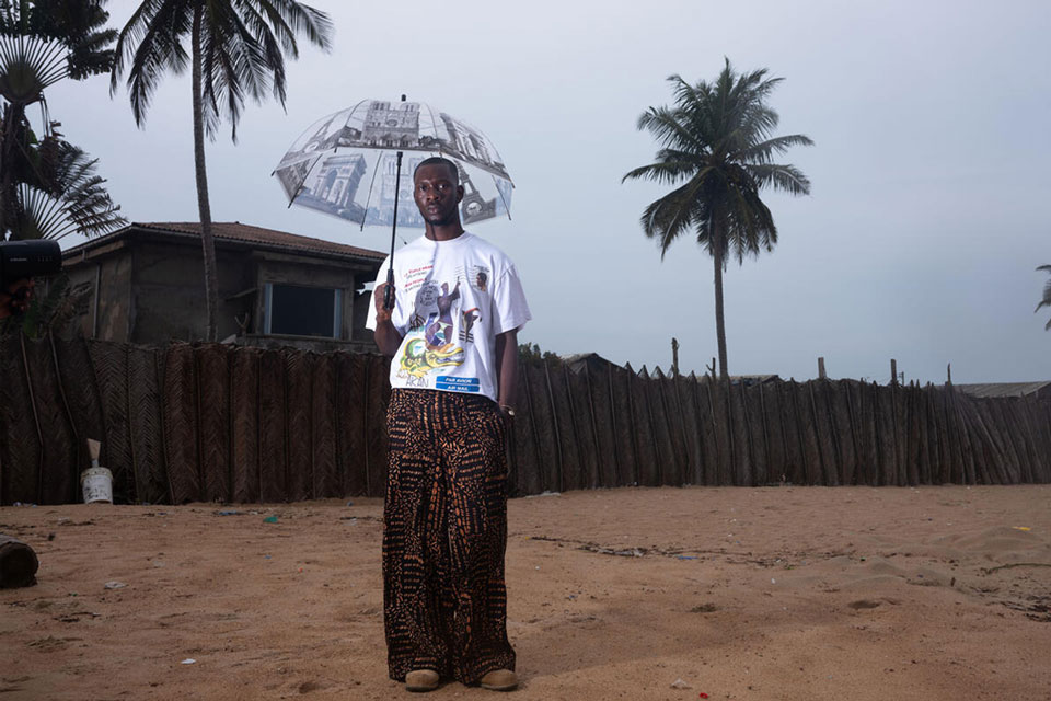 Jean-Luc, photographer, 24. A lover of fashion and music, he has been vaccinated since he was a child. Abidjan, Côte d'Ivoire. June 2025. © Newsha Tavakolian / Magnum Photos