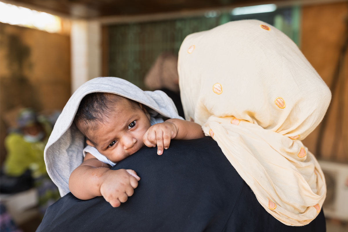 A mother brings her child to get vaccinated at a health centre in Niamey, Niger. Credit: Isaac Griberg